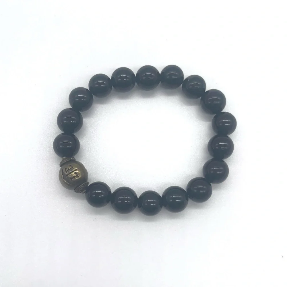 Onyx Stretch Bracelet w/ gold tone zen charm